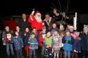 Gareth Wyn Jones, Father Christmas and the Mayor of Builth Wells are greeted by many of the children present. Picture: Ernie Husson