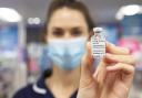 EDITORIAL USE ONLY.Mary Saunders, Regional Nurse Manager holds the AstraZeneca/Oxford Covid-19 vaccine at Superdrug in Guildford. PA Photo. Picture date: Thursday January 14, 2021. From 8am-8pm, seven days a week, in-store pharmacists and nurses will be