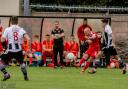 David Cotterall in action for Newtown at Flint Town United. Picture by H18-PDW Photography.