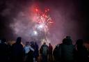 People gather to watch the fireworks display at Maes-y-Dre, Welshpool in 2021.