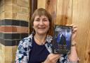 Kim Gravell with a copy of her book To Pay For The Crossing which was published last year.