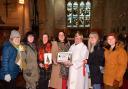 Winners the ‘Woolly Wednesdays’, pictured with Rev Janet Day.