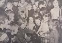 Maesyrhandir Primary School pupils pet a lamb on a school visit in 1980.