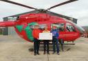 The Radnor Twurzels, including Gareth Price (left) and Jeff and Reg Evans, presenting the cheque at the Welshpool base.