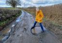 Councillor Heather Kidd with one of the many potholes in south-west Shropshire.