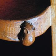 Robert 'Mouseman' Thompson's iconic furniture designs feature a characteristic mouse carved on them. Picture above is an example of a mouse carved by Thompson.