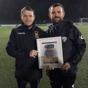 Nathan Leonard (right) receiving an award on behalf of FC Oswestry Town last season. Picture by NWCFL website