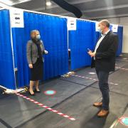 Chief executive of Powys Teaching Health Board Carol Shillabeer chats to RWAS chief executive Steve Hughson at the showground's vaccination centre.