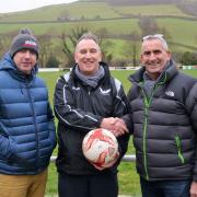Bow Street FC secretary Peter James and chairman Wyn Lewis with club sponsor Alun Phillips in 2020. Picture: Bow Street FC.