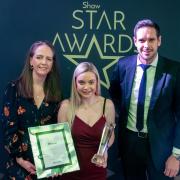 Amy Smith (centre) receives her award