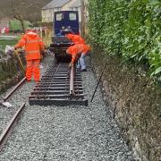 Volunteers laying track at Corris Railway.