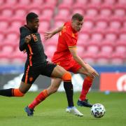 Netherlands' Myron Boadu (left) Wales' Ryan Astley (right) battle for the ball during the UEFA European U21 Championship qualifying match at the Parc y Scarlets, Llanelli. Picture date: Saturday June 11, 2022..