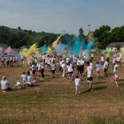 Runners on the start line for the Machynlleth carnival Colour Run.
