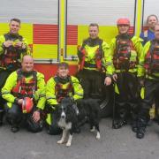 Hay firefighters (l-r) Harry Ratcliffe, Jeremy Turner, Adrian Lawford (the dog whisperer, with Milo), Stephen Ratcliffe, Luke Newton and Richard Wildee, joined by Huey Lloyd (far left) and Dan Bridgeman and Luke Dewinton (back, far right) from Builth