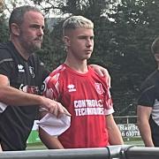 Arnie Roberts with manager Chris Hughes and assistant Callum McKenzie.