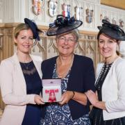 Heather Kidd, Shropshire councillor for Chirbury and Worthen, with her eldest daughters Fiona Douzi and Eleanor Simmons after being made a Member of the Order of the British Empire (MBE) during an Investiture ceremony at Windsor Castle on October 24,