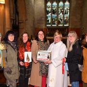 Winners the ‘Woolly Wednesdays’, pictured with Rev Janet Day.