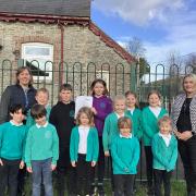 Pupils and staff at Gladestry Primary school celebrate their Estyn Report