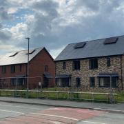 Council homes built on the former Red Dragon pub and Maesyrhandir Youth Centre site in Newtown.