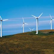 Builth Wells and Llandrindod Wells town councils are joining forces over “divisive” plans to develop windfarms near both towns.