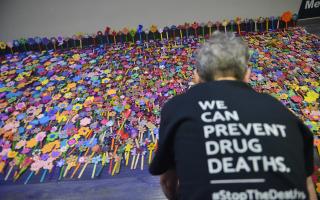 GLASGOW, SCOTLAND - FEBRUARY 26: paper flowers are laid to represent drug deaths at the Scottish Drug Deaths Crisis Conference at the SEC. Speakers include Scottish public health minister Joe FitzPatrick, Glasgow City Council leader Susan Aitken, senior