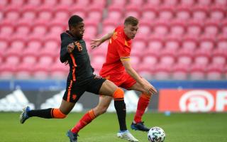Netherlands' Myron Boadu (left) Wales' Ryan Astley (right) battle for the ball during the UEFA European U21 Championship qualifying match at the Parc y Scarlets, Llanelli. Picture date: Saturday June 11, 2022.