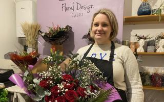 Hollie Hulme, owner of Hollie's Floral Designs, with a Valentine's Day bouquet at her florist shop in Llanidloes.