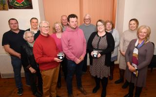 Chairman Elwyn Jones (c) is pictured with Brian Tolley (front l), Samantha Price(centre r), Alvina Beehan, Paget Silvester, Joy Groves and Ffion Corfield, as well as other members of Llanafanfawr Community Council.