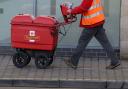 Royal Mail worker delivering  post