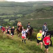 Man v Horse is a mad race that pits runners against riders in the hills surrounding Llanwrtyd Wells.