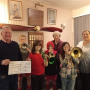 Knighton Town Silver Band (Training Band) members, pictured with show chairman Paul Davies.