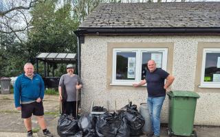 Volunteers Rich, Ali and Dave, who helped clean up the damage left on Machynlleth Football Club.