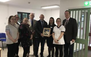Pictured (l-r) are Carlene Jenkins and Myfanwy Jones (pharmacy assistants), Susan Lily (Llangammarch Town Council clerk), James Davies, Alan Jones, Rebecca Baker (pharmacist manager), Katheryn Richards (pharmacy assistant) and Peter James.