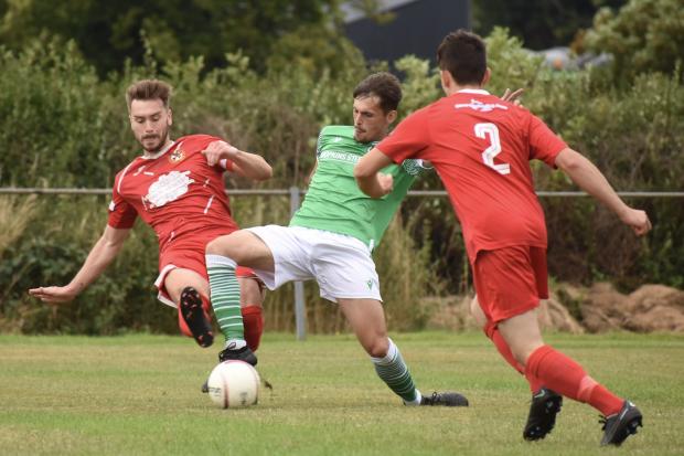 County Times: Action from Rhayader Town's victory at Carno.  Photo by Tim Evans.