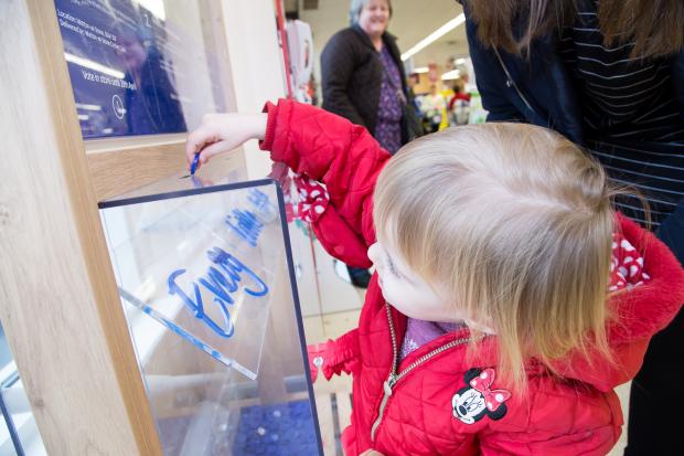 Tesco bags of help, child casting her vote. Picture: Kevin Lines