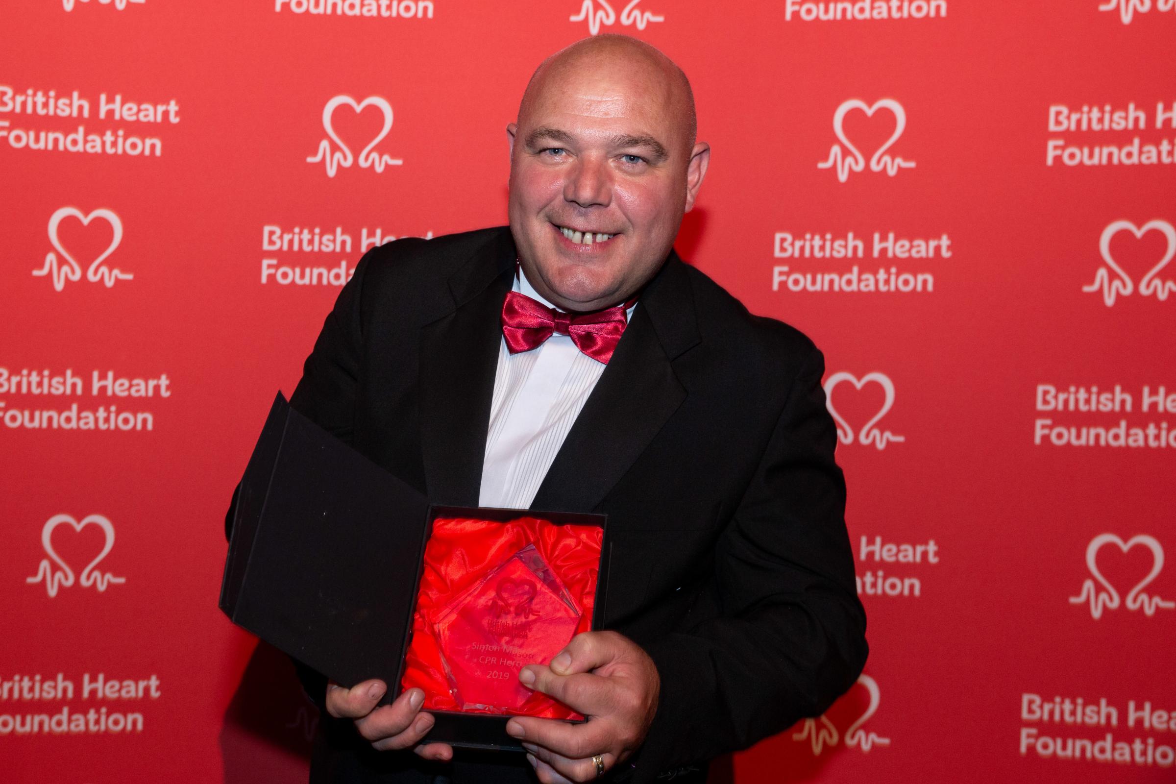 Powys landlord Simon Mason with his Heart Hero honour at the British Heart Foundation Awards in 2019. Photo: British Heart Foundation
