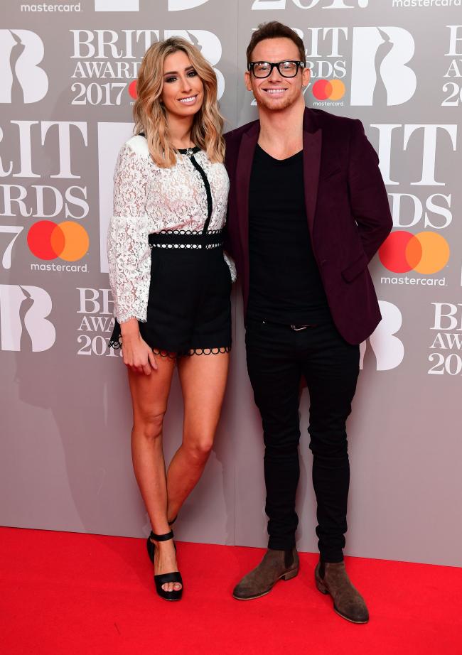 PA File Photo of Stacey Solomon and Joe Swash attending the Brit Awards. See PA Feature TOPICAL Beauty Solomon. Picture credit should read: Ian West/PA Photos. WARNING: This picture must only be used to accompany PA Feature TOPICAL Beauty Solomon.