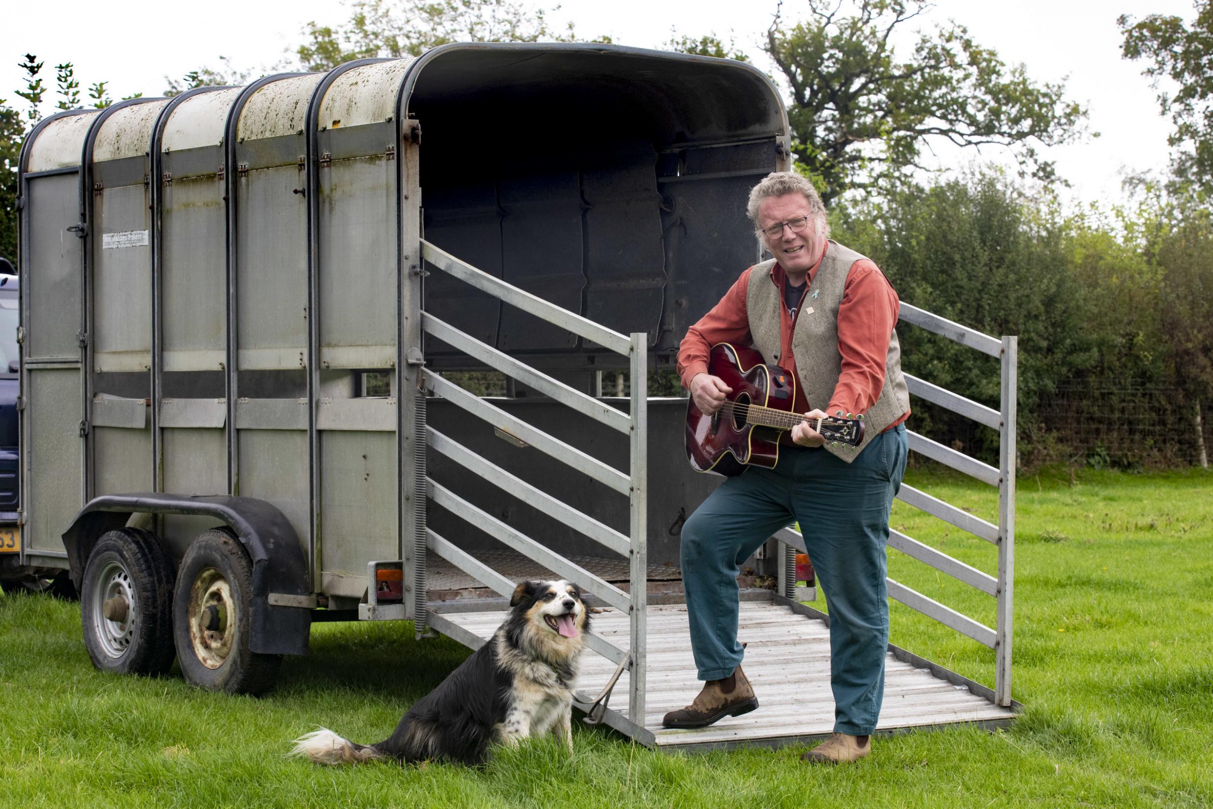 John Hughes the Singing farmer sing a song about Ifor Williams Trailers, Pictured The Singing Farmer John Hughes and his dog Poppy. Picture Mandy Jones.