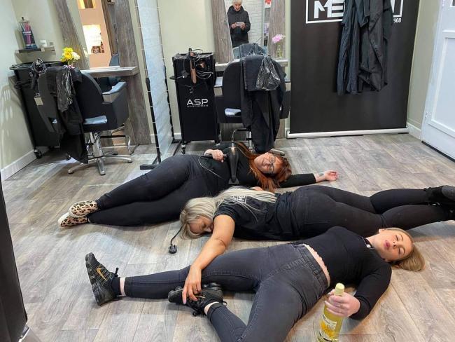 Exhausted Meraki staff - owner Sadie Williams (centre), Michelle Snooke (l) and Rebecca Thomas - pose for this picture after a hectic first day back at the office on Monday