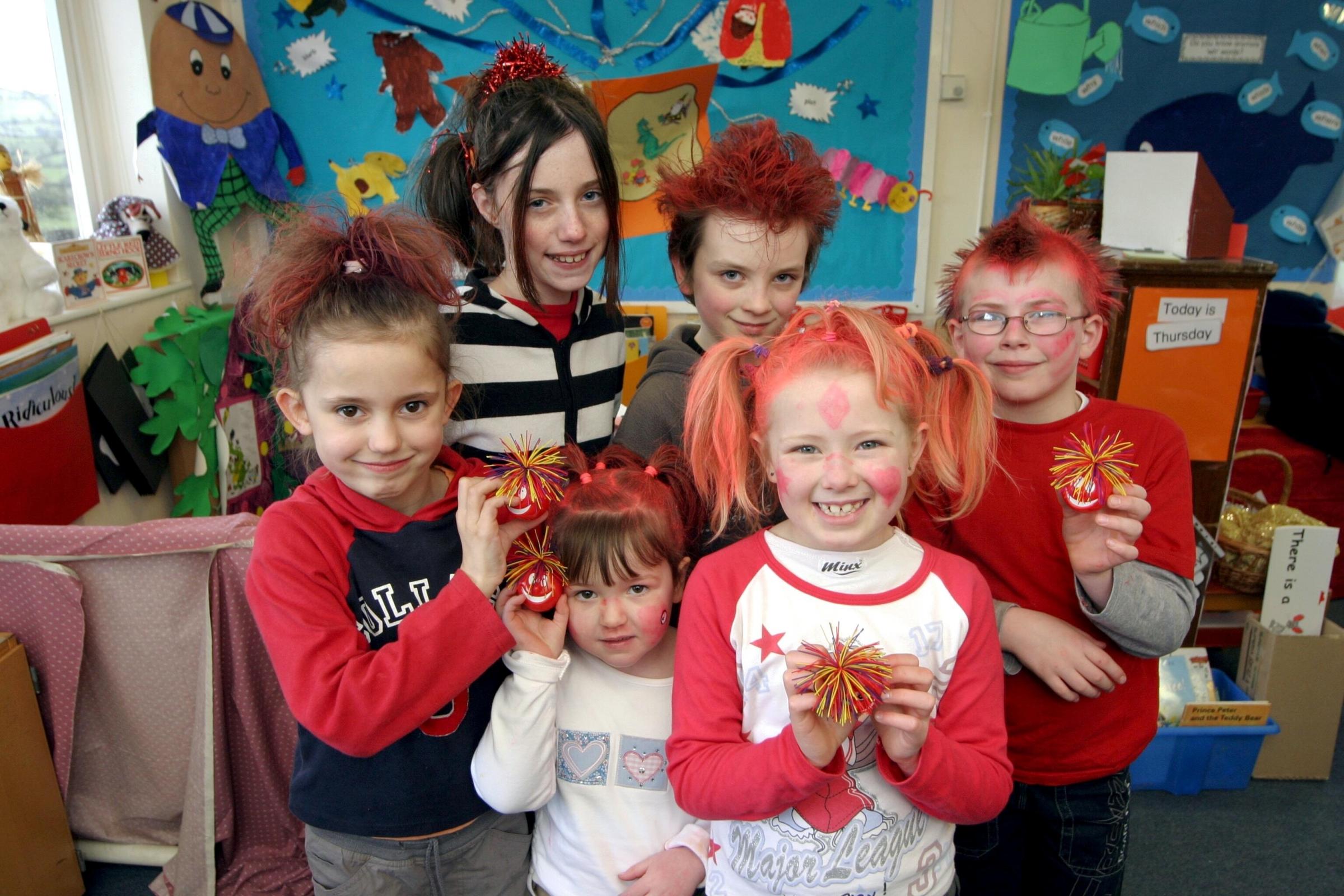 Comic Relief Red Nose Day 2005. The winners of the mad hair contest at Ysgol Bro Cynnaith, Llansilin, from left - Grace Fensome, Allegra Barker, Jessica Morris, Asher Hawkins - Brown, Katie Williams, Thomas Williams. HD110305.