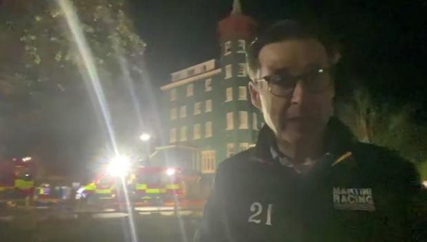 County Times: Metropole owner Justin Baird-Murray outside the iconic hotel, with fire crews still on the scene