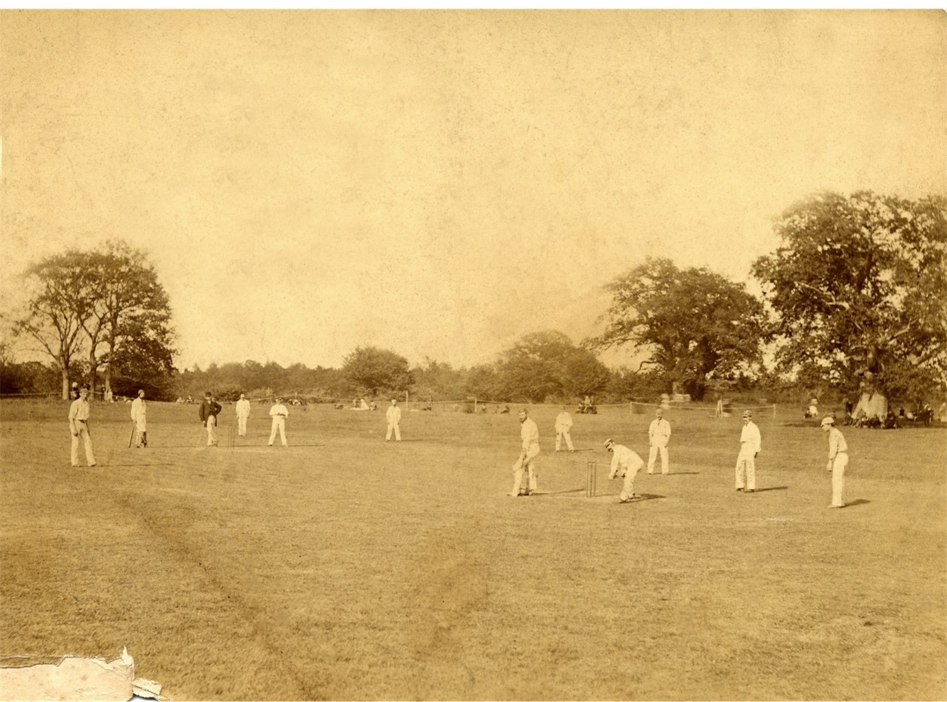 A photograph showing Walter Gilbert about to bowl with Harry Jupp standing at mid-on. The batsman is the Montgomery captain Harry Evans and the wicket keeper is Charles Kennedy of Sussex.