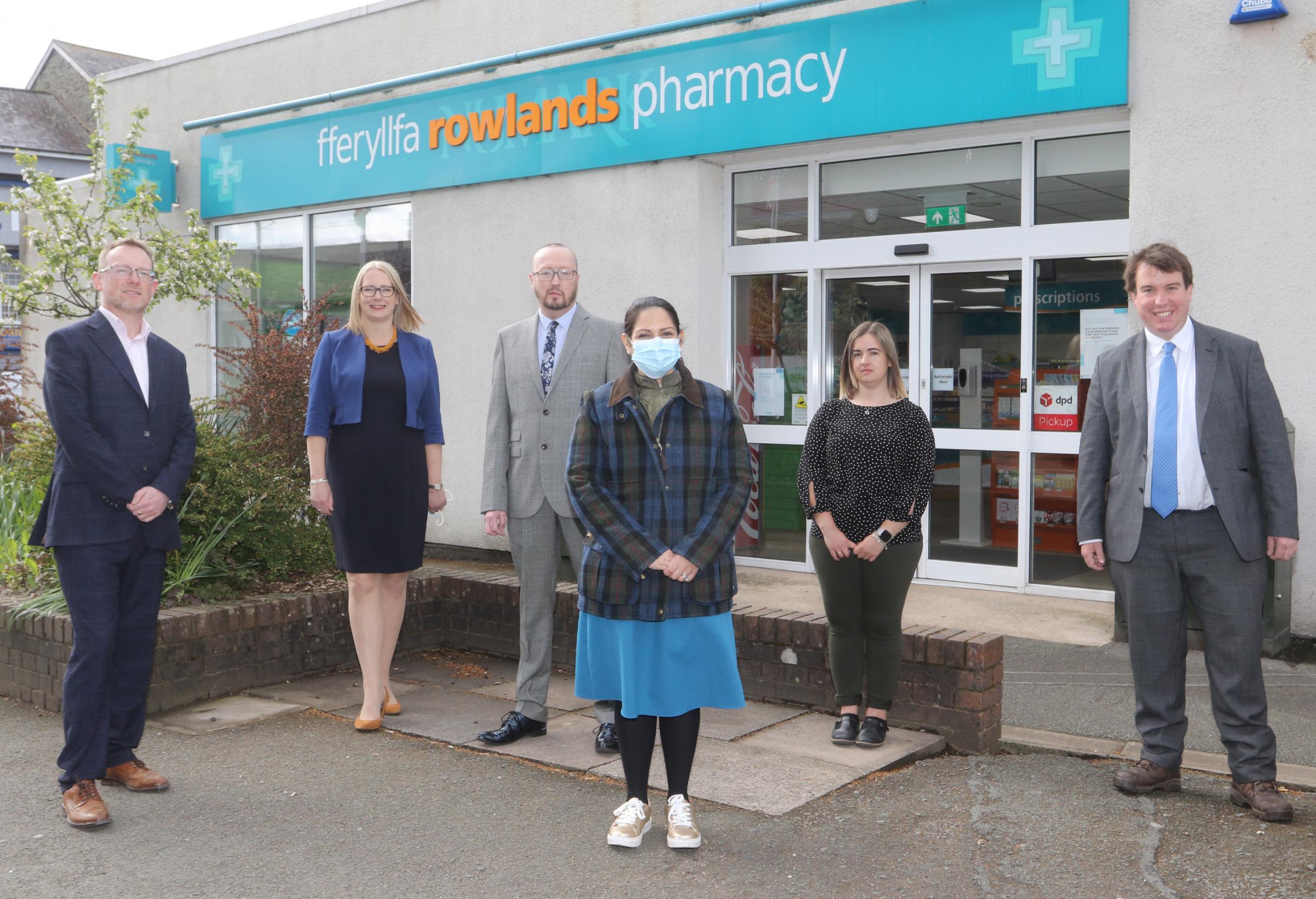 Home Secretary Priti Patel visit to Welshpool with Craig Williams MP and Russell George AM on Wednesday 5th May 2021. Pictured talking to staff from Rowlands Pharmacy, Welshpool. Picture by Phil Blagg Photography. PB020-2021-7