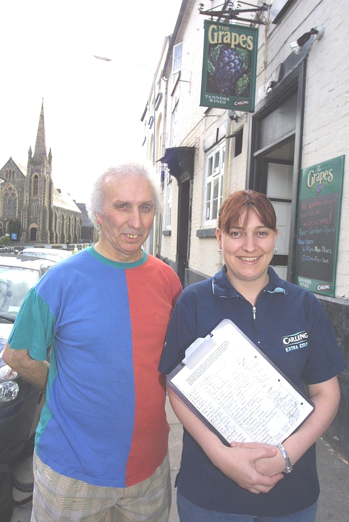 Philip Glynn and Helen Davies with a petition to get CCTV installed in the area.
