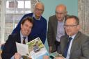 Montgomeryshire’s MP Craig Williams and Assembly Member Russell George discuss the 10-year Montgomery Canal restoration plan with Montgomery Waterway Restoration Trust chair Michael Limbrey (standing left) and Montgomery Canal Partnership chair John