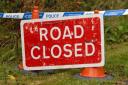 A road on the Powys border has been closed due to a landslide.
