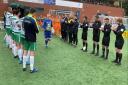 Paul Harrison receives a guard of honour on Saturday. Picture by Brian Jones.