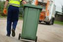 Bin collections have been delayed for weeks in the north of Powys.