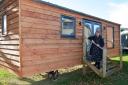 Salop Leisure Innovative Solutions’ project manager Samantha Stubbs with one of the shepherd's huts