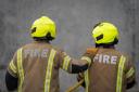 Fire crews tackle Powys house fire as slates fly off the top building